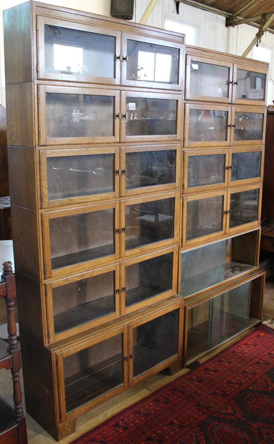 Pair of Minty oak glazed sectional bookcases